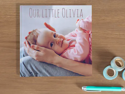Design baby photo books in large or small, with matching binding, cover and paper type with Pixum.